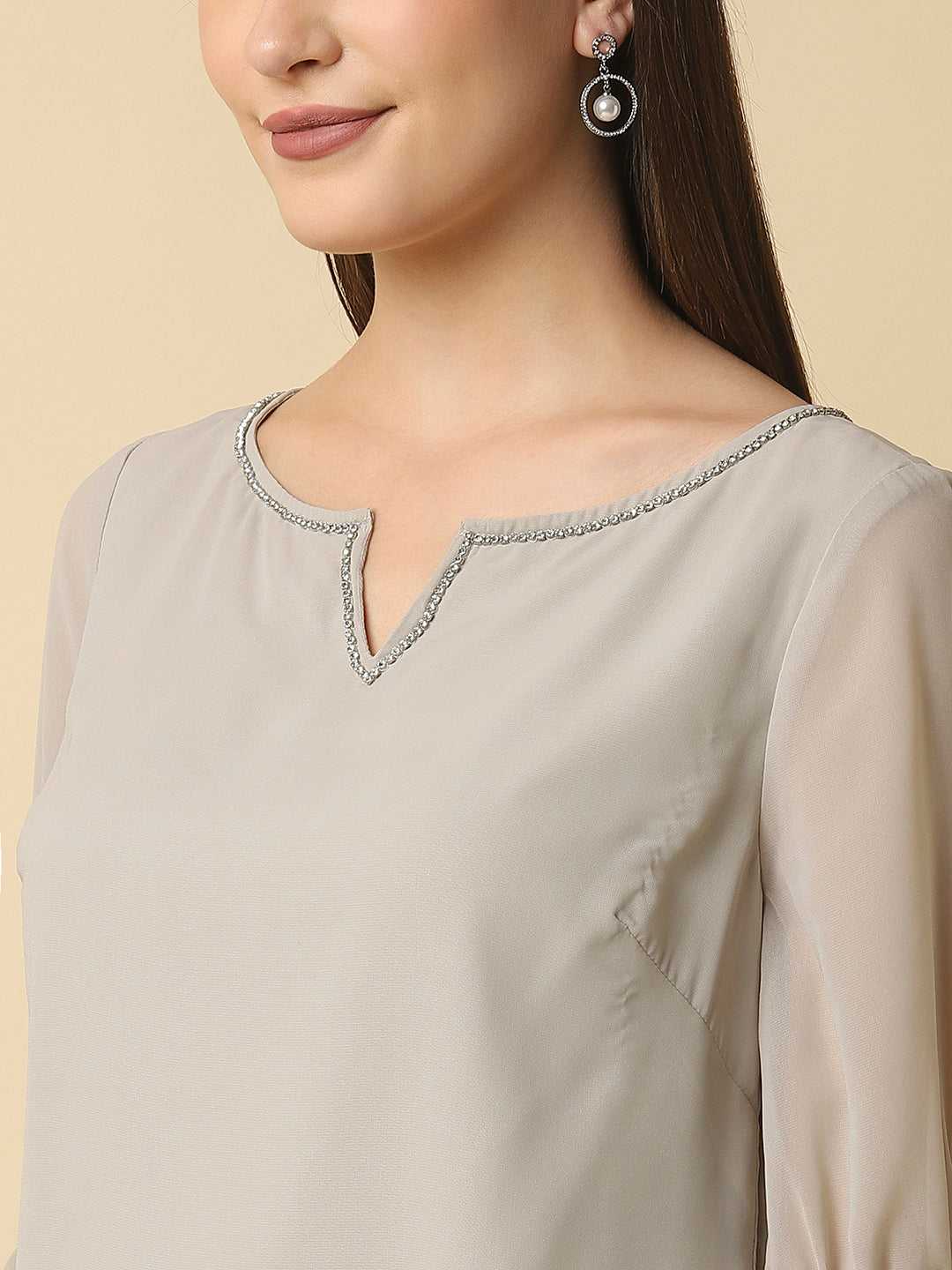 stygian beige top